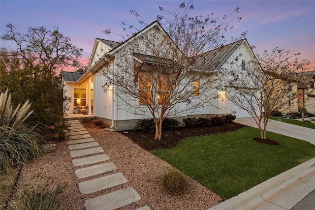 130 Volterra Ln, Dripping Springs, TX 78620 - view of front facade featuring a lawn and metal roof