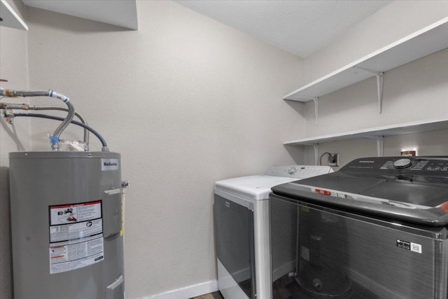 708 Baumgarten St, Schulenburg, TX 78956 - laundry area with electric water heater and washer and dryer