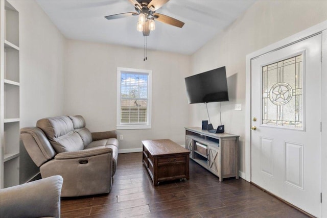 708 Baumgarten St, Schulenburg, TX 78956 - living area with a ceiling fan and dark wood-style flooring