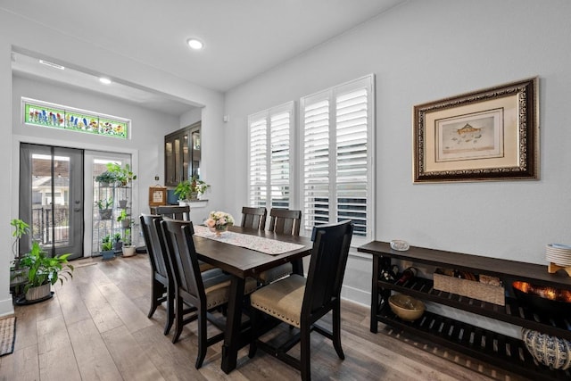217 Palio Pl, Georgetown, TX 78628 - dining room featuring wood finished floors, french doors, recessed lighting, and baseboards
