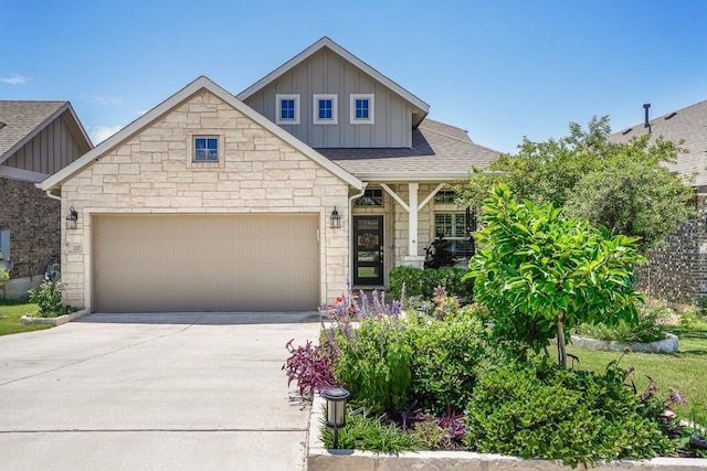 217 Palio Pl, Georgetown, TX 78628 - craftsman house featuring board and batten siding, stone siding, driveway, a garage, and a shingled roof