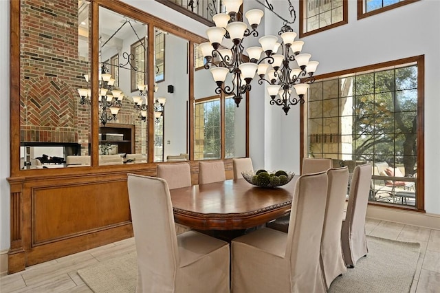 114 Flying Scot St, Lakeway, TX 78734 - dining space with a high ceiling, a chandelier, and light tile patterned flooring