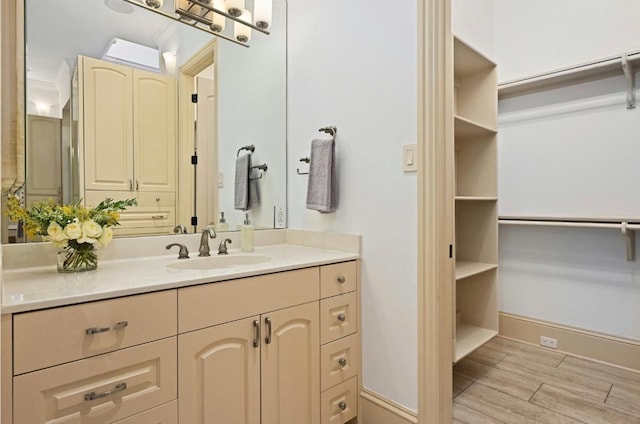 114 Flying Scot St, Lakeway, TX 78734 - bathroom featuring vanity, wood finished floors, and baseboards