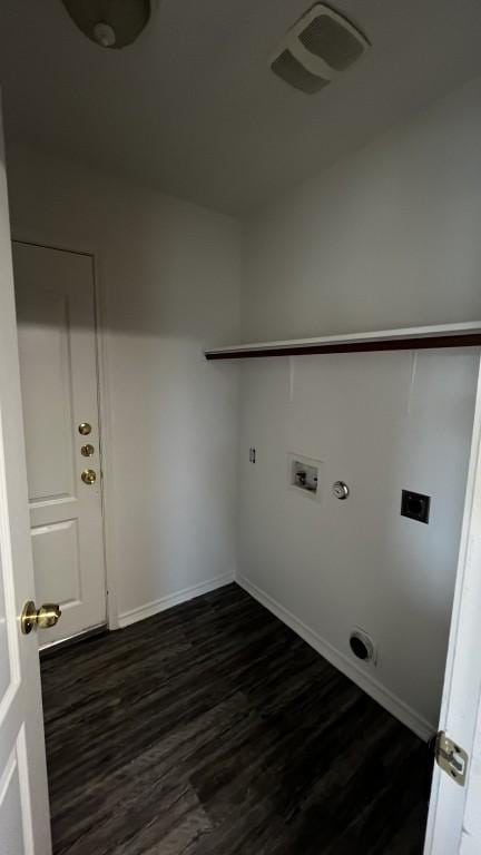13217 Perconte Dr, Del Valle, TX 78617 - laundry room featuring hookup for an electric dryer, dark wood finished floors, gas dryer hookup, and baseboards