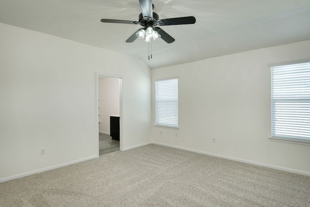 11648 Cambrian Rd, Manor, TX 78653 - spare room with light carpet, ceiling fan, plenty of natural light, baseboards, and vaulted ceiling