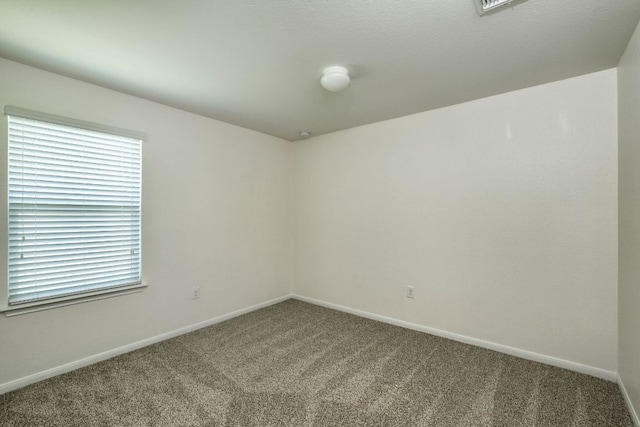 11648 Cambrian Rd, Manor, TX 78653 - carpeted empty room featuring baseboards