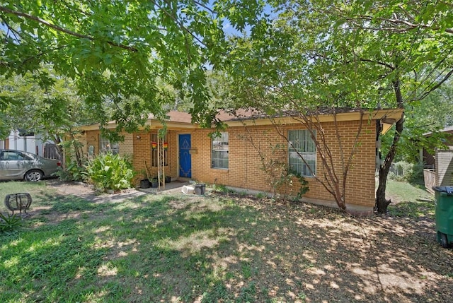 1905 Chestnut Ave, Austin, TX 78722 - single story home with brick siding and a front lawn