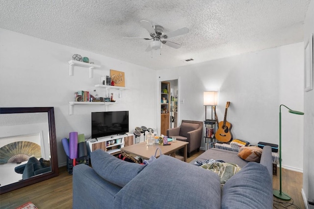 1905 Chestnut Ave, Austin, TX 78722 - living room with wood finished floors, a ceiling fan, and a textured ceiling
