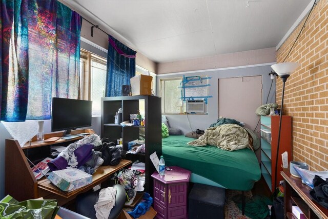 1905 Chestnut Ave, Austin, TX 78722 - bedroom with brick wall and cooling unit