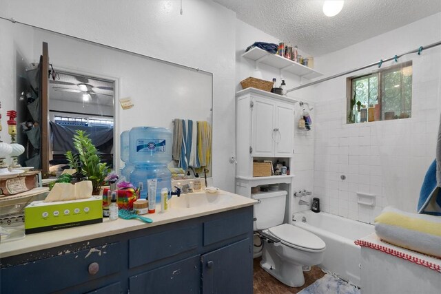 1905 Chestnut Ave, Austin, TX 78722 - bathroom with a textured ceiling, vanity, and tub / shower combination