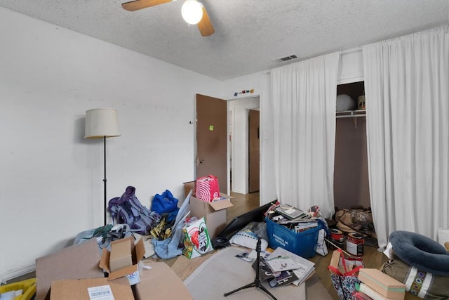 1905 Chestnut Ave, Austin, TX 78722 - bedroom with a textured ceiling, wood finished floors, and ceiling fan