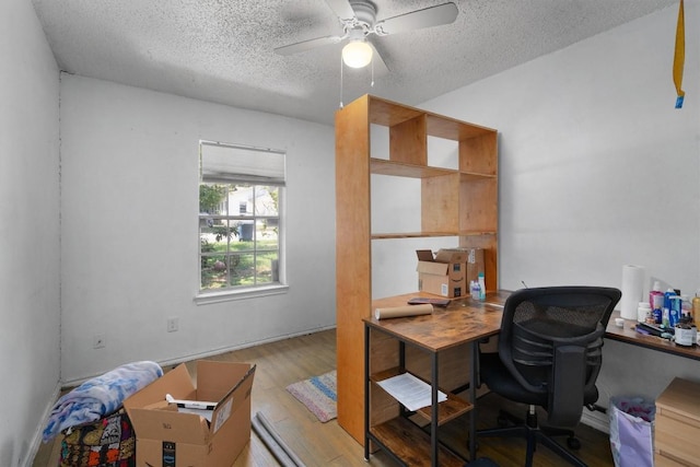 1905 Chestnut Ave, Austin, TX 78722 - home office with a textured ceiling, wood finished floors, and ceiling fan