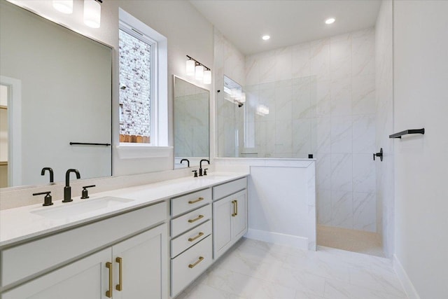 1409 S Brook Dr, Leander, TX 78641 - bathroom with double vanity, a walk in shower, marble look tile flooring, and recessed lighting