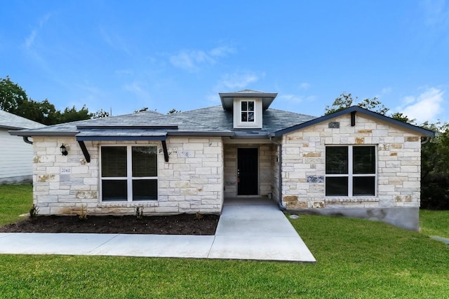20411 Rockpark Ln, Lago Vista, TX 78645 - view of front of property featuring stone siding and a front lawn