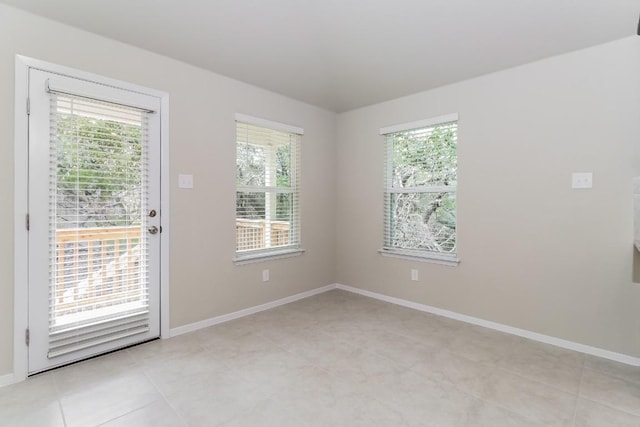 20411 Rockpark Ln, Lago Vista, TX 78645 - empty room featuring healthy amount of natural light and light tile patterned floors