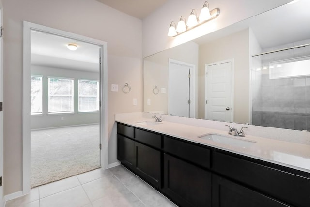 20411 Rockpark Ln, Lago Vista, TX 78645 - bathroom featuring double vanity, tile patterned floors, and a tile shower