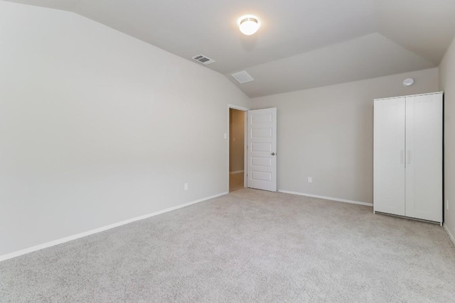 20411 Rockpark Ln, Lago Vista, TX 78645 - unfurnished bedroom featuring lofted ceiling and light carpet
