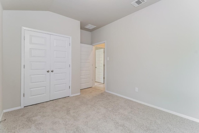20411 Rockpark Ln, Lago Vista, TX 78645 - unfurnished bedroom with carpet flooring, a closet, and lofted ceiling