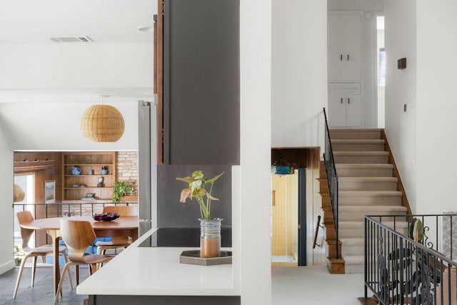 staircase featuring visible vents