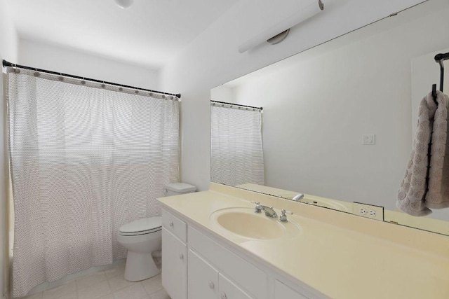 bathroom featuring curtained shower, toilet, and vanity