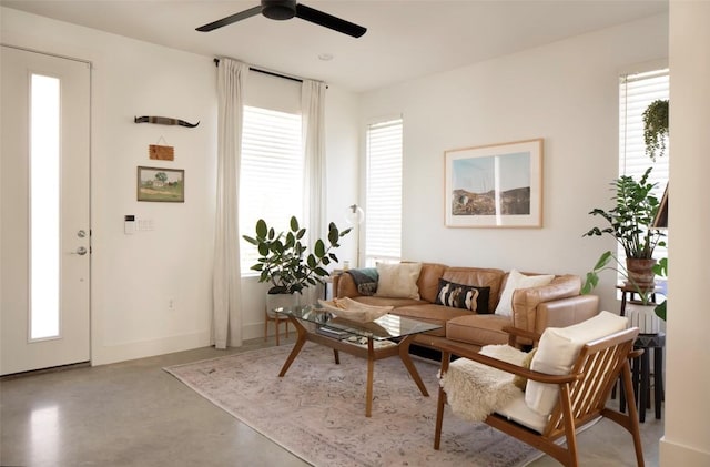 1145 Shady Ln Unit 1B, Austin, TX 78721 - living area featuring finished concrete floors, a ceiling fan, and baseboards