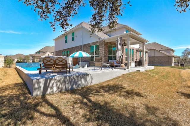 212 Tovas Secret Cv, Georgetown, TX 78628 - back of property featuring a patio area, a fenced in pool, fence, a lawn, and ceiling fan
