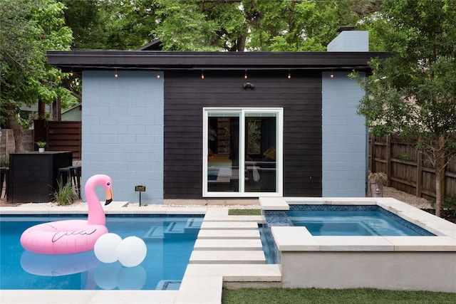 1502 Haskell St, Austin, TX 78702 - view of pool with an in-ground hot tub and an outdoor structure
