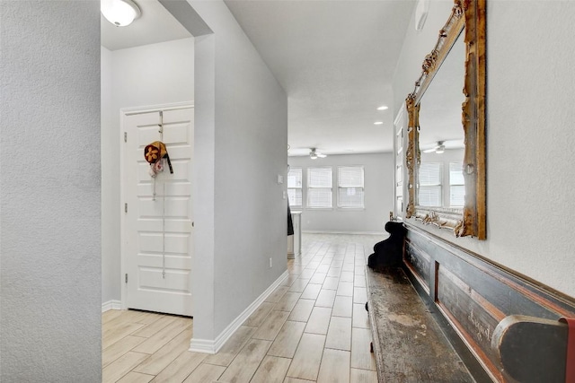 1813 Artesian Springs Xing, Leander, TX 78641 - hall featuring wood tiled floors, recessed lighting, and a textured wall