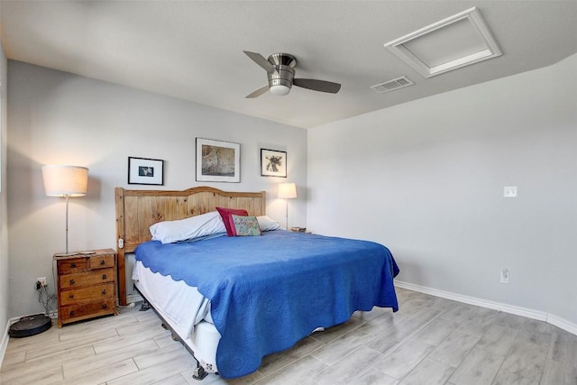 1813 Artesian Springs Xing, Leander, TX 78641 - bedroom featuring attic access, wood tiled floors, and a ceiling fan
