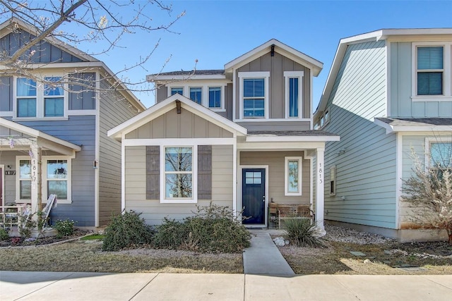 1813 Artesian Springs Xing, Leander, TX 78641 - view of front of property featuring board and batten siding and covered porch