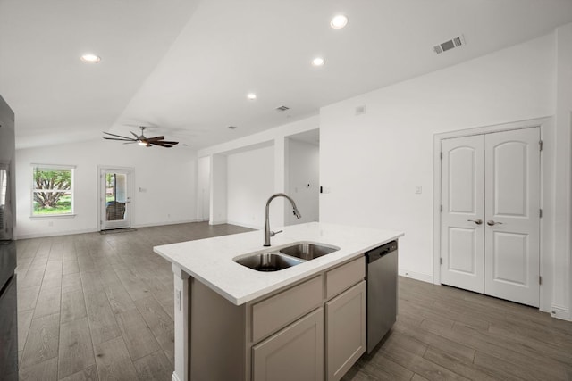 21203 Santa Rosa Ave, Lago Vista, TX 78645 - kitchen with dishwasher, vaulted ceiling, light countertops, a kitchen island with sink, and a ceiling fan
