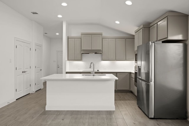 21203 Santa Rosa Ave, Lago Vista, TX 78645 - kitchen featuring appliances with stainless steel finishes, gray cabinetry, decorative backsplash, light countertops, and recessed lighting