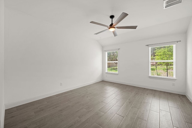 21203 Santa Rosa Ave, Lago Vista, TX 78645 - empty room featuring wood finished floors, vaulted ceiling, and a ceiling fan