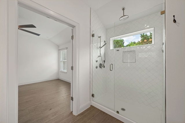 21203 Santa Rosa Ave, Lago Vista, TX 78645 - full bath featuring lofted ceiling, healthy amount of natural light, wood finished floors, a stall shower, and ceiling fan