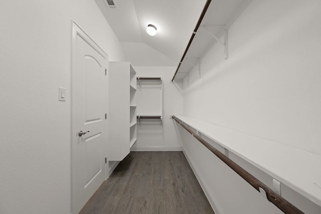21203 Santa Rosa Ave, Lago Vista, TX 78645 - walk in closet with dark wood-type flooring and vaulted ceiling