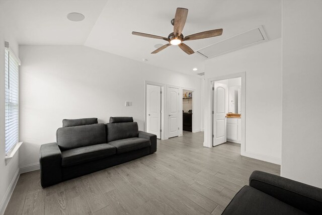 21203 Santa Rosa Ave, Lago Vista, TX 78645 - living area with attic access, ceiling fan, healthy amount of natural light, wood finished floors, and lofted ceiling