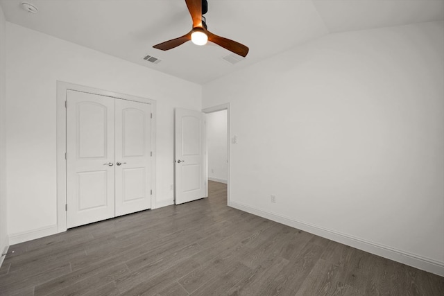 21203 Santa Rosa Ave, Lago Vista, TX 78645 - unfurnished bedroom with dark wood-style flooring, a closet, and a ceiling fan
