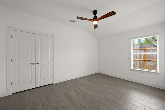 21203 Santa Rosa Ave, Lago Vista, TX 78645 - unfurnished bedroom with vaulted ceiling, wood finished floors, ceiling fan, and a closet