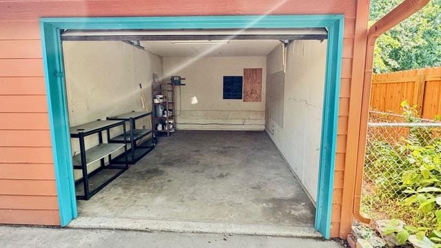 garage with fence