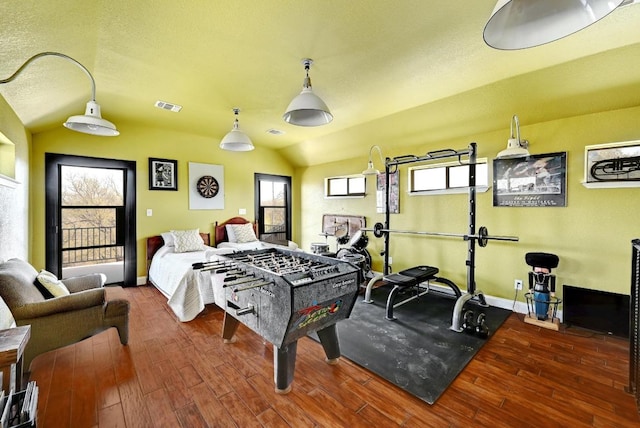 playroom featuring baseboards, vaulted ceiling, and wood finished floors