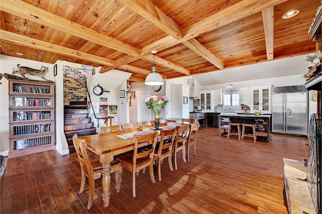dining space with wood finished floors, stairway, wooden ceiling, and beam ceiling