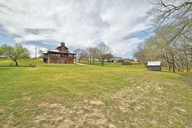 view of yard with an outdoor structure and a barn