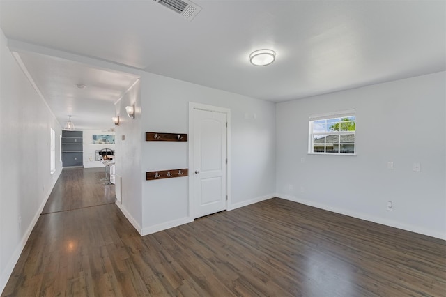 155 Travis Ln, Spicewood, TX 78669 - spare room featuring dark wood finished floors and baseboards