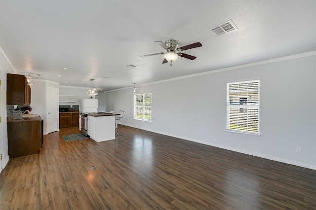155 Travis Ln, Spicewood, TX 78669 - unfurnished living room with crown molding, a ceiling fan, dark wood-style flooring, and baseboards
