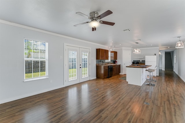 155 Travis Ln, Spicewood, TX 78669 - kitchen featuring open floor plan, freestanding refrigerator, crown molding, dark wood-type flooring, and ceiling fan