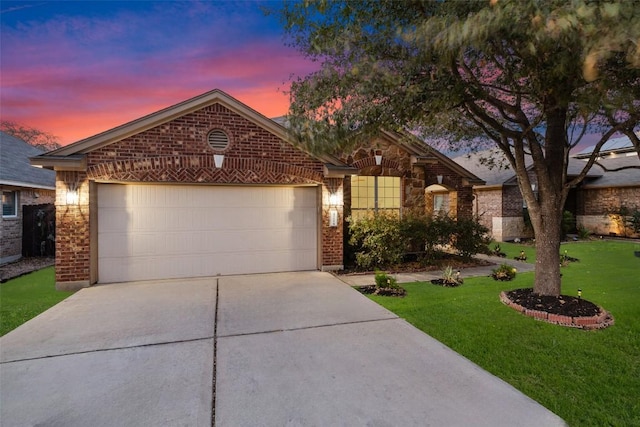 471 Bayou Bend Dr, Buda, TX 78610 - ranch-style house with concrete driveway, brick siding, an attached garage, a front lawn, and stone siding