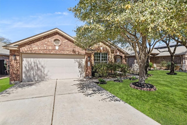471 Bayou Bend Dr, Buda, TX 78610 - view of front of home featuring brick siding, driveway, a garage, and a front lawn
