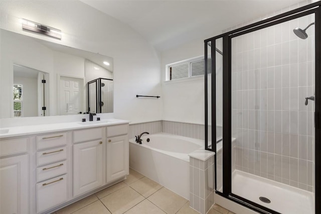 471 Bayou Bend Dr, Buda, TX 78610 - full bath featuring a shower stall, a bath, double vanity, tile patterned flooring, and vaulted ceiling