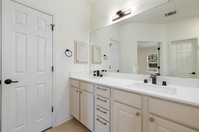 471 Bayou Bend Dr, Buda, TX 78610 - full bathroom with double vanity and tile patterned flooring