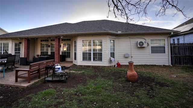 4209 N Sunflower Ln, Temple, TX 76502 - back of house featuring outdoor lounge area, a patio area, ac unit, and roof with shingles